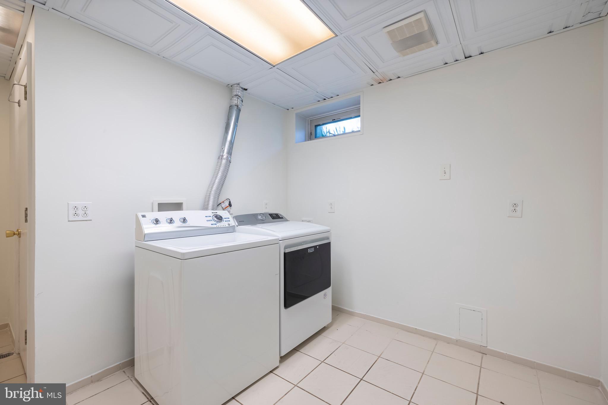 9821 Singleton Drive Bethesda, MD 20817 - Photo 38 of 45 a utility room with a sink and mirror
