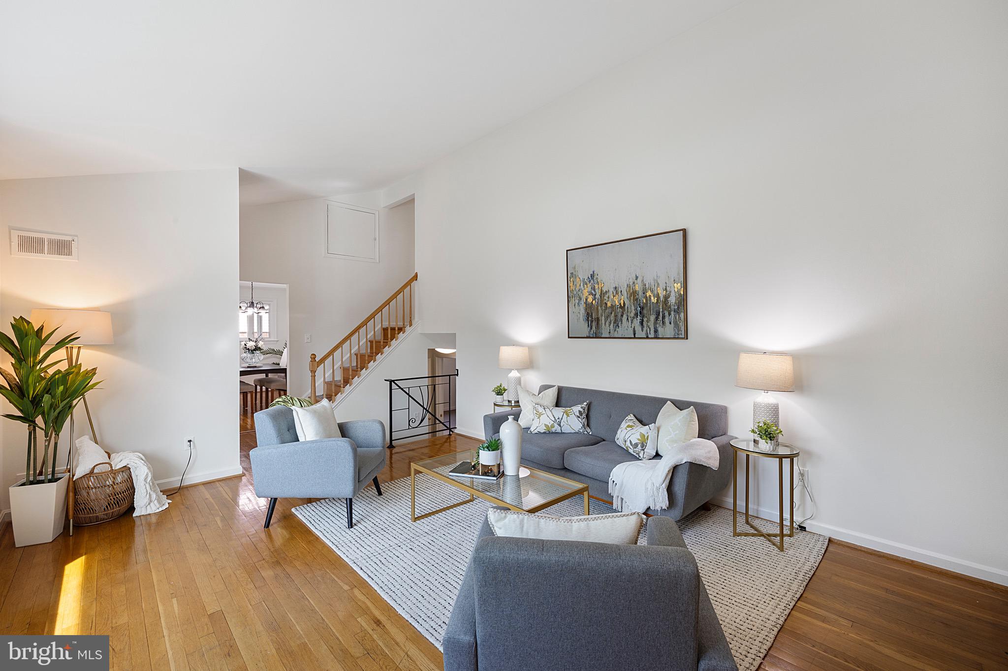 9821 Singleton Drive Bethesda, MD 20817 - Photo 4 of 45 a living room with furniture and a couch