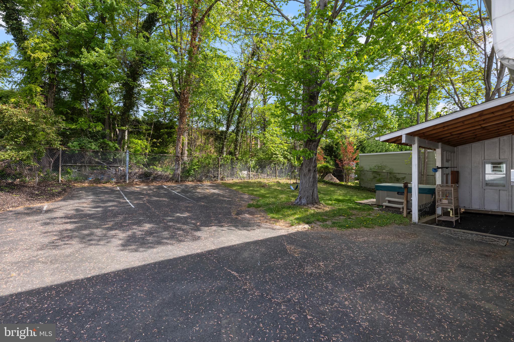 9821 Singleton Drive Bethesda, MD 20817 - Photo 43 of 45 a view of a house with backyard and trees