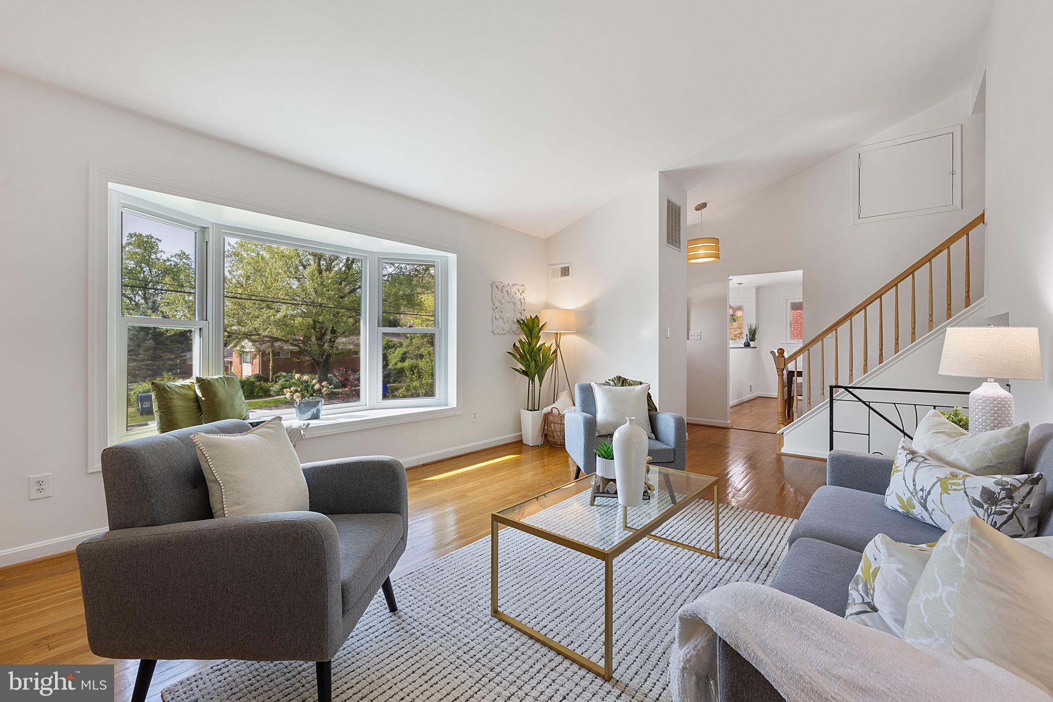 9821 Singleton Drive Bethesda, MD 20817 - Photo 5 of 45 a living room with furniture and a large window