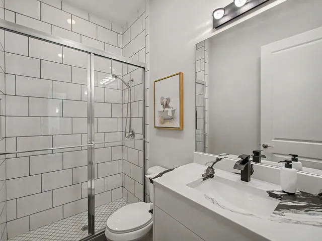 a bedroom with a bed a couch and a window