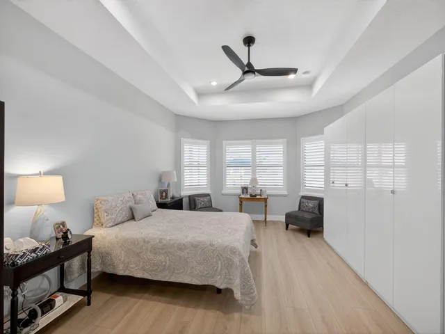 a very nice looking open shower a mirror and a sink