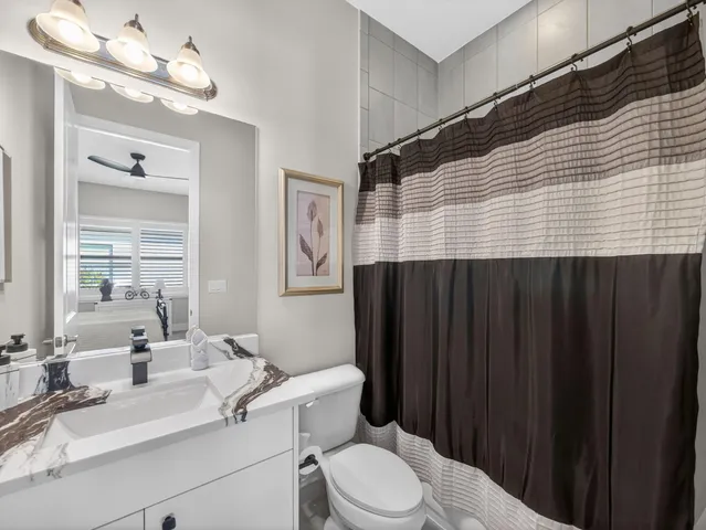 a outdoor space with furniture and a ceiling fan