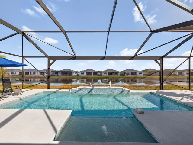 a view of a patio with a table and chairs