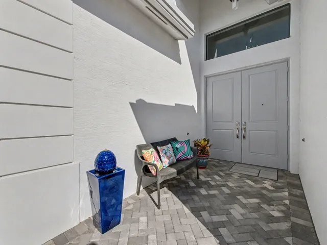 a view of an empty room and wooden floor