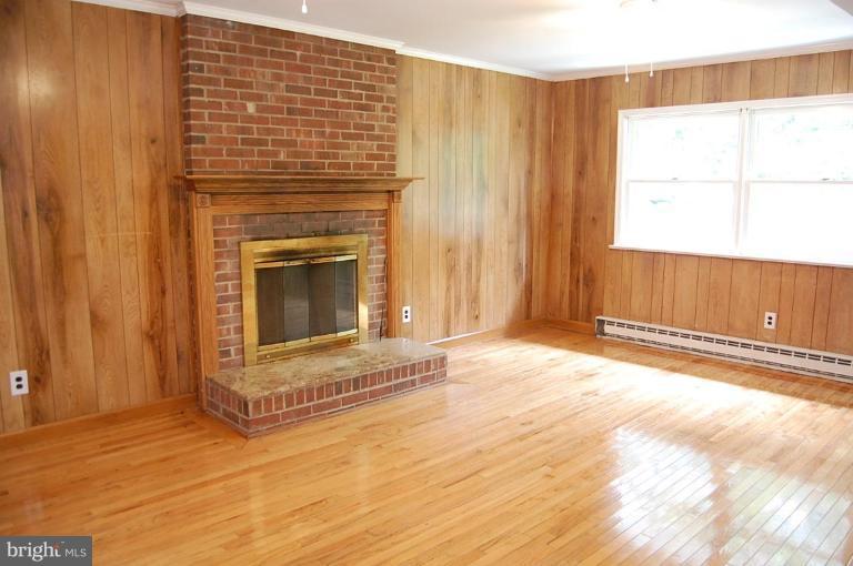11401 Rambling Road Gaithersburg, MD 20879 - Photo 7 of 26 Wood burning fireplace & brick hearth.