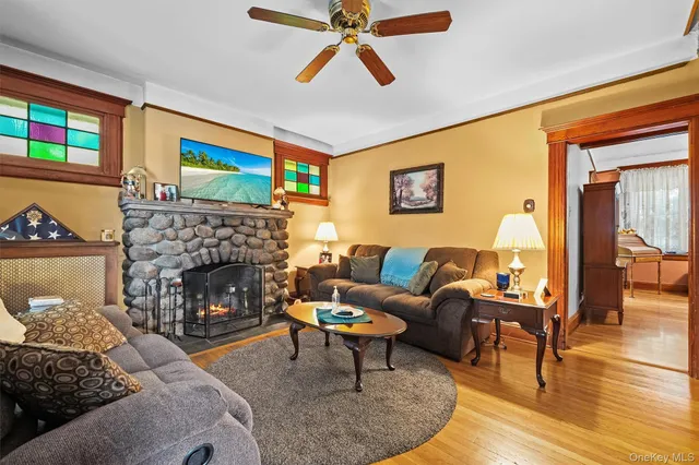 a living room with furniture and a fireplace