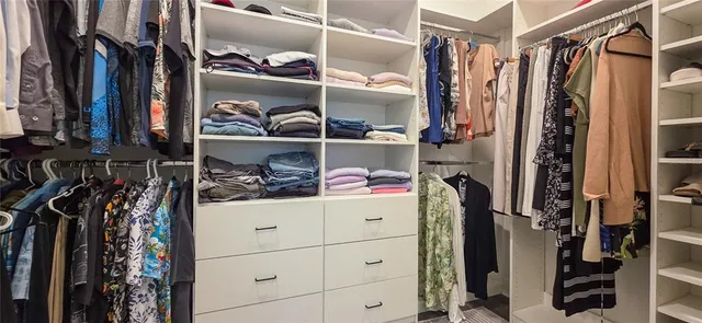a bathroom with a shower and mirror