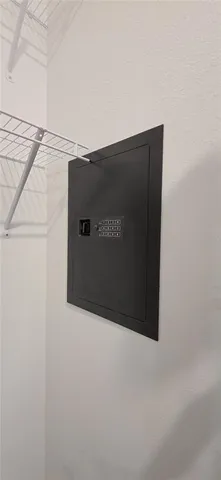 a bed sitting in a bedroom next to a window with dresser