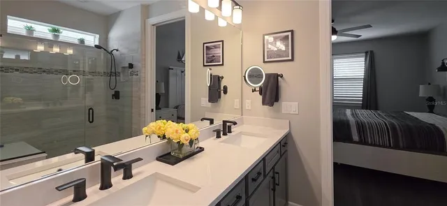 a bedroom with a flat screen tv and a bed