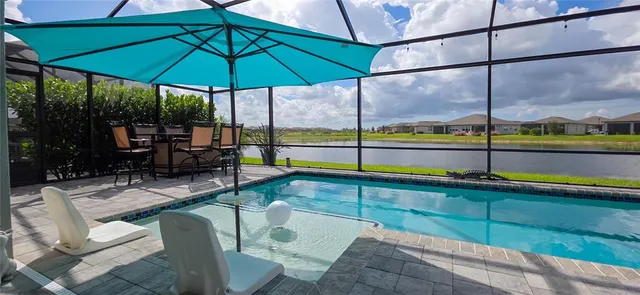a view of a chairs and table in the patio