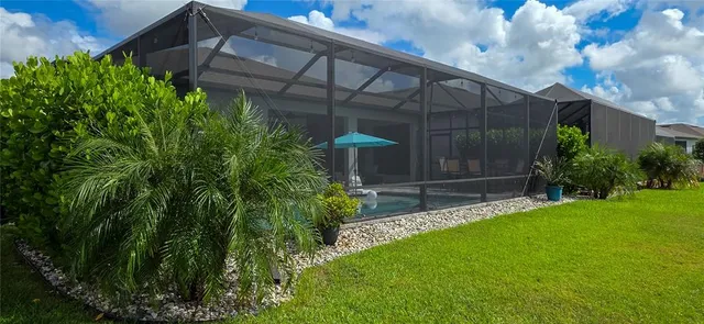 an aerial view of a house with a swimming pool