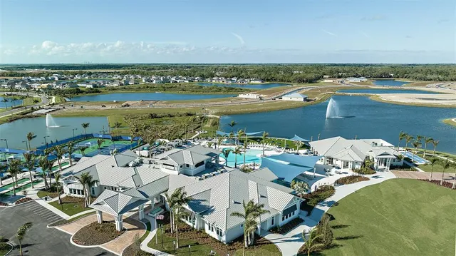 a view of a swimming pool with a bench and floor to ceiling windows