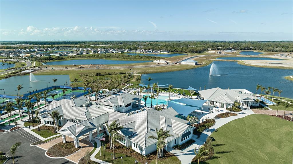10619 Wynward Way Palmetto, FL 34221 - Photo 62 of 69 an aerial view of a residential building with outdoor space and seating