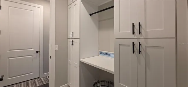 a view of a sink and a washer in a kitchen