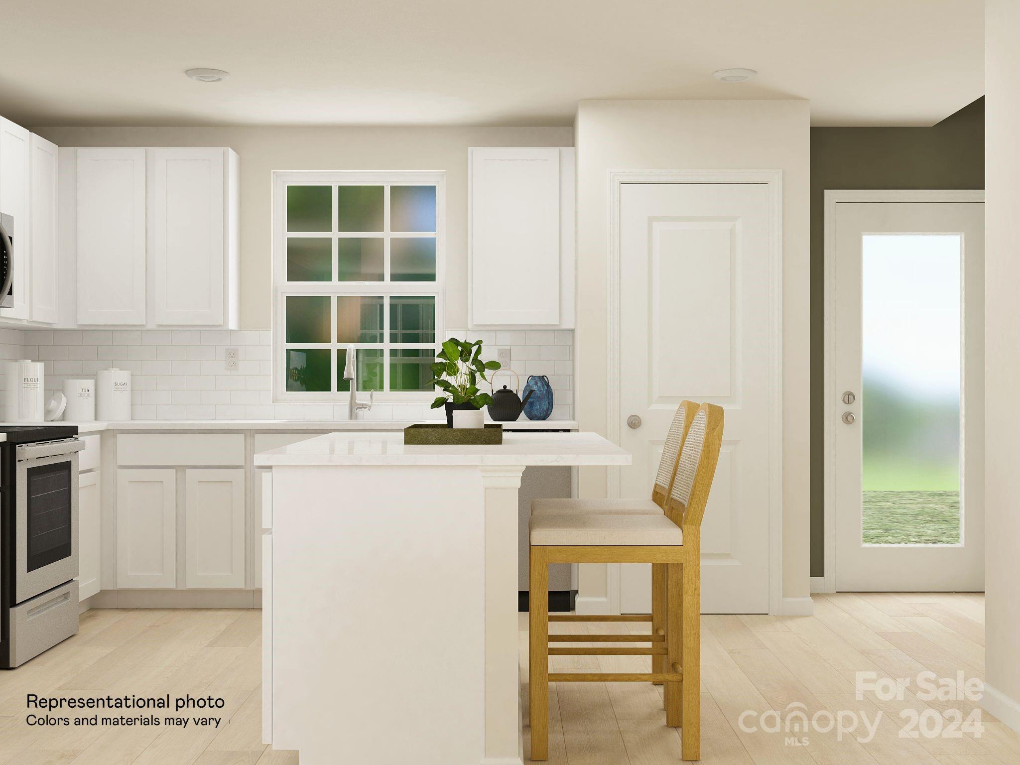679 Mile Crk Road, Unit 101 Edgemoor, SC 29712 - Photo 11 of 21 a kitchen with a table and chairs in it