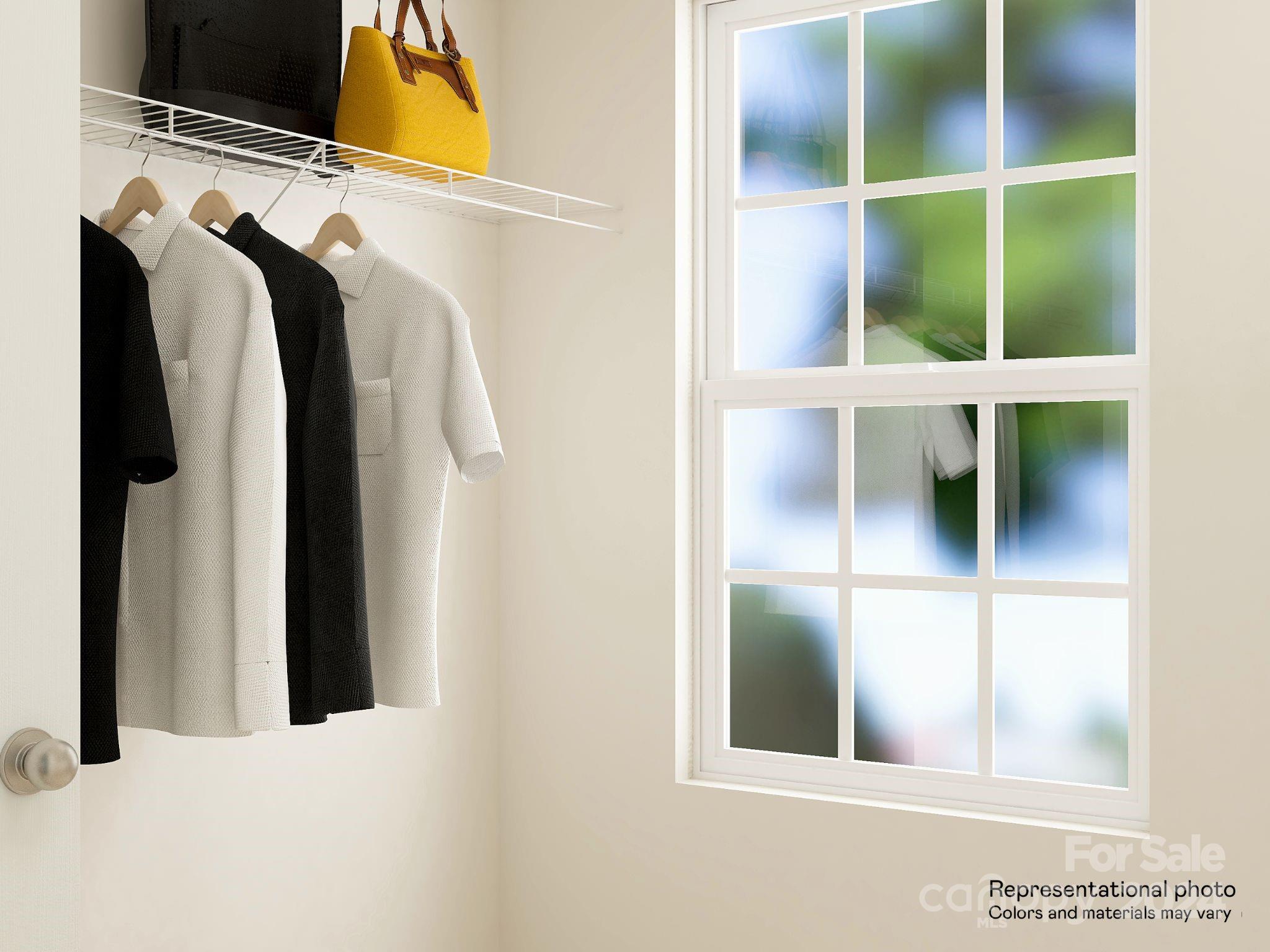 679 Mile Crk Road, Unit 101 Edgemoor, SC 29712 - Photo 18 of 21 a view of walk in closet with clothes and shoes