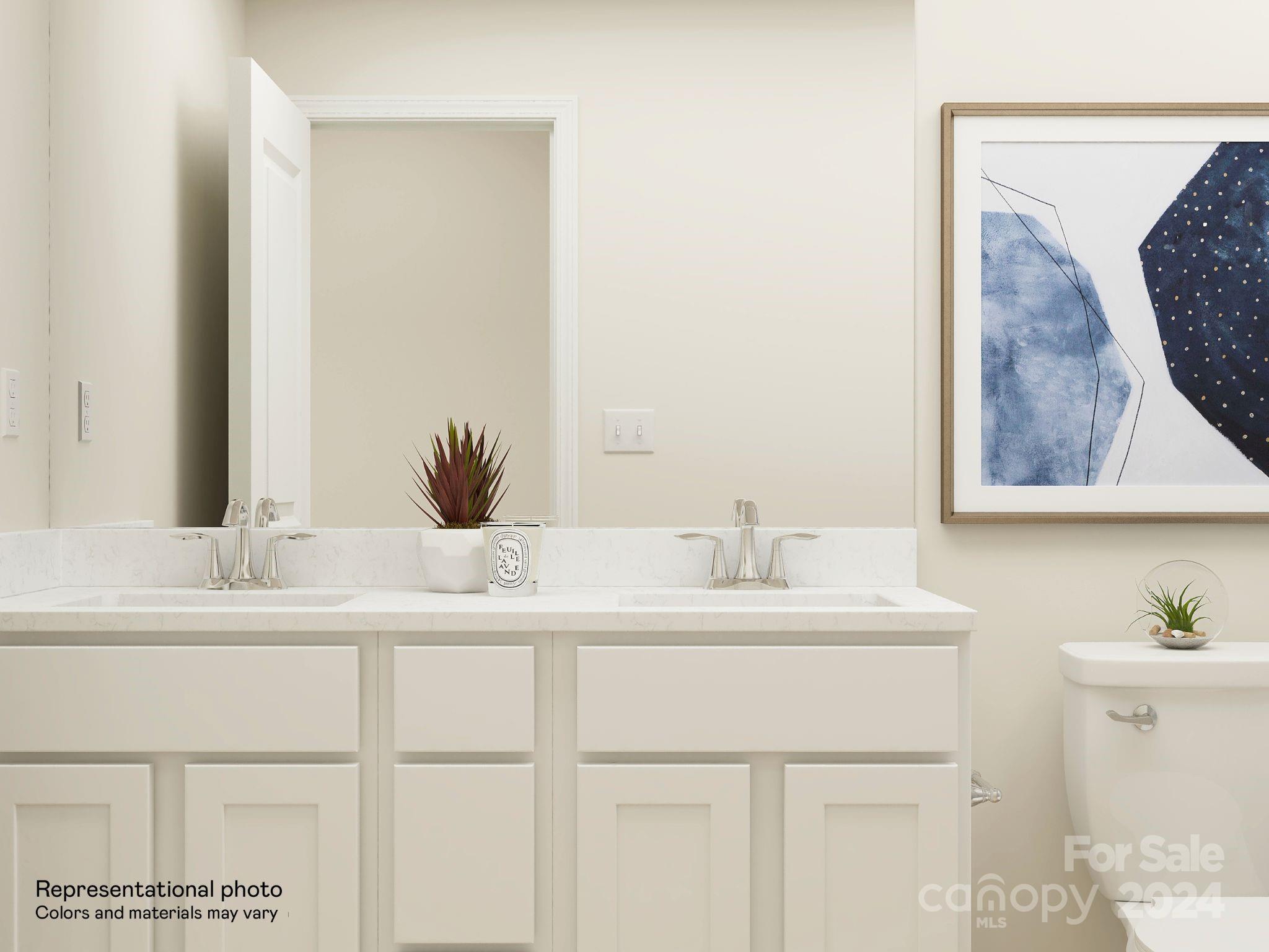 679 Mile Crk Road, Unit 101 Edgemoor, SC 29712 - Photo 3 of 21 a bathroom with a double vanity sink and a mirror