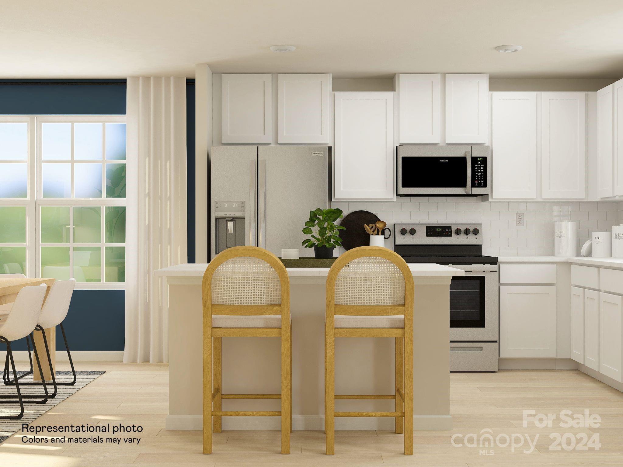 679 Mile Crk Road, Unit 101 Edgemoor, SC 29712 - Photo 10 of 21 a kitchen with stainless steel appliances kitchen island granite countertop a refrigerator a stove top oven a sink dishwasher and white cabinets with wooden floor