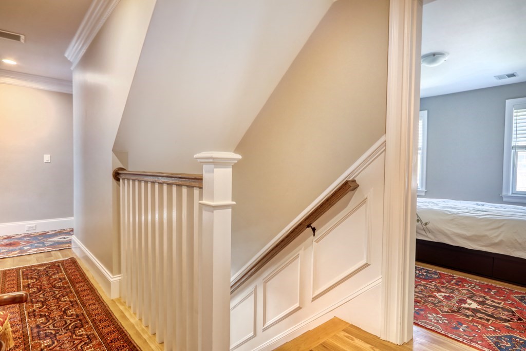 52 Thorpe Road Needham, MA 02494 - Photo 15 of 39 a view of a hallway with wooden floor and staircase