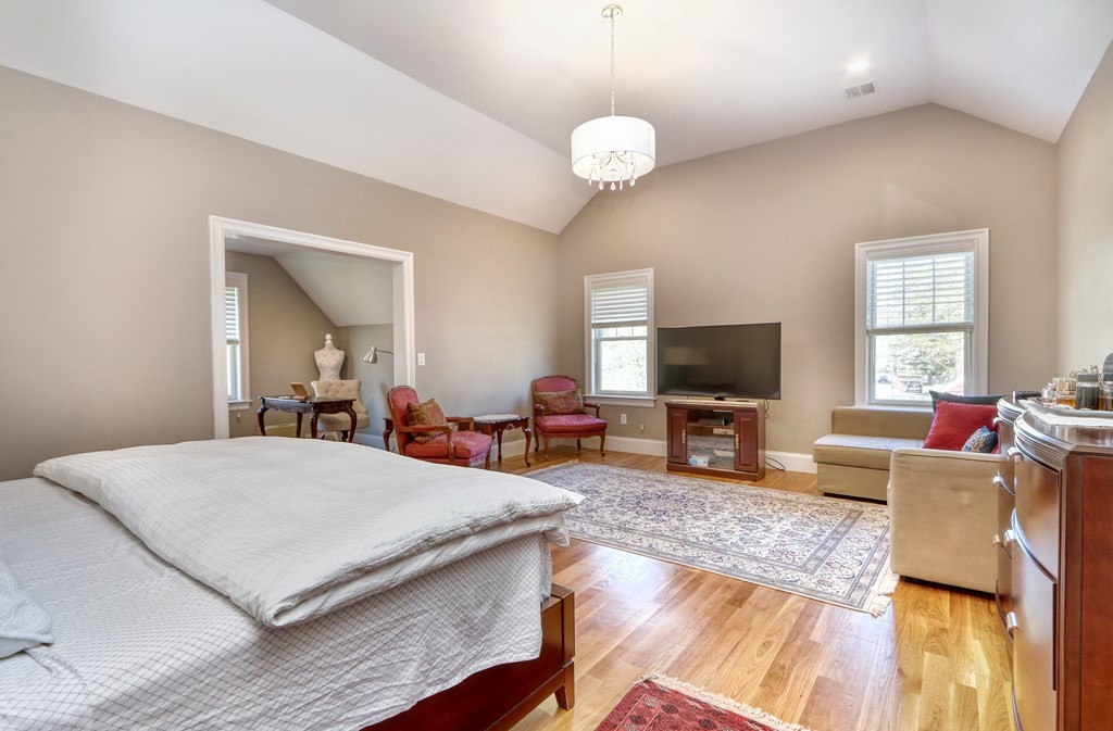 52 Thorpe Road Needham, MA 02494 - Photo 18 of 39 a living room with furniture and a flat screen tv