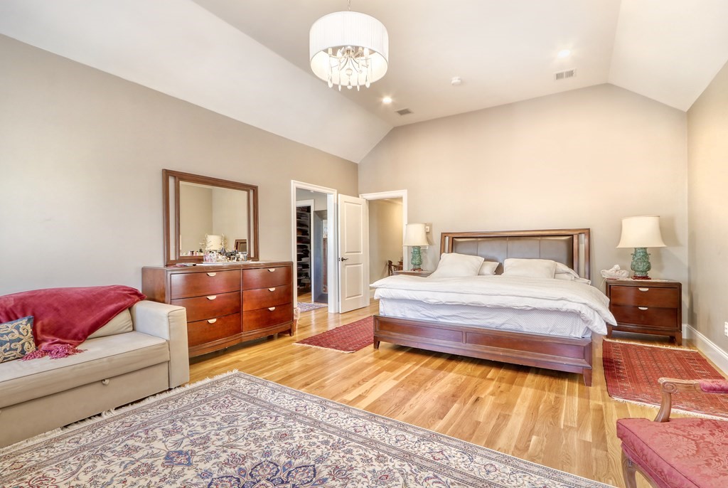 52 Thorpe Road Needham, MA 02494 - Photo 19 of 39 a bedroom with a bed and a couch