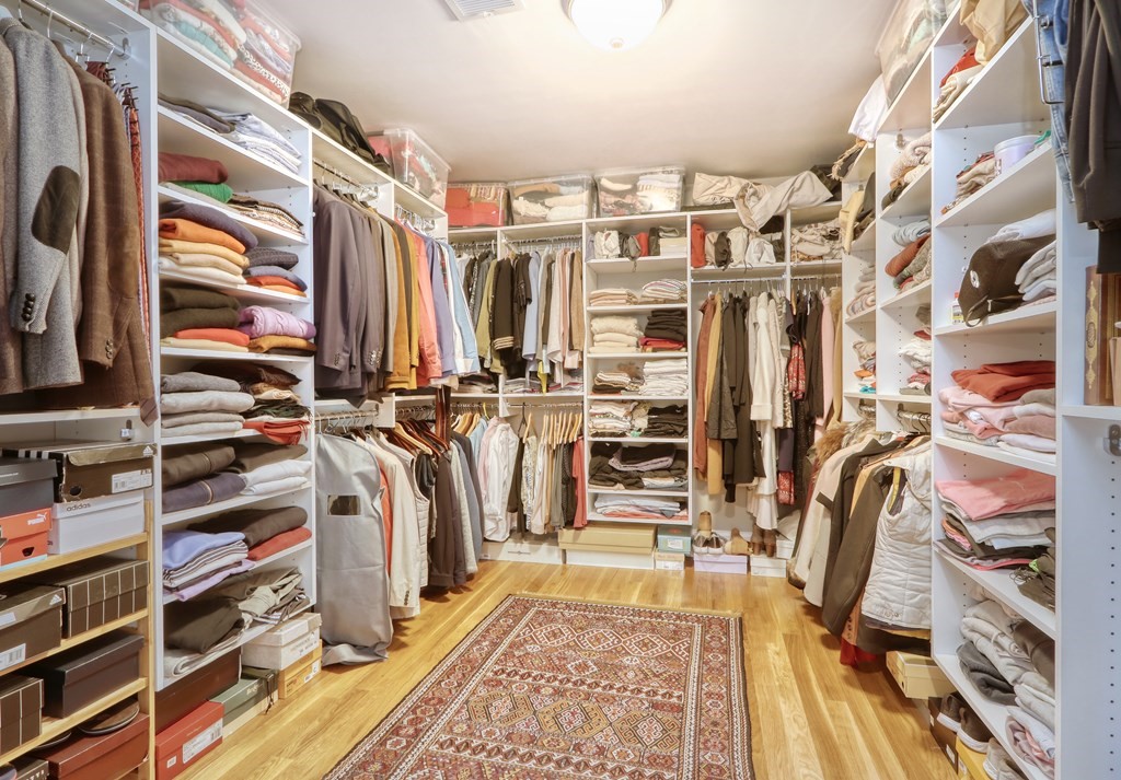 52 Thorpe Road Needham, MA 02494 - Photo 23 of 39 a view of walk in closet with clothes and shoes