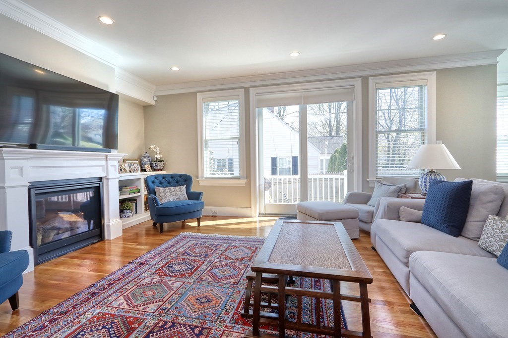 52 Thorpe Road Needham, MA 02494 - Photo 6 of 39 a living room with furniture and a fireplace