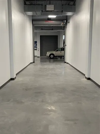 a view of a livingroom with a car parked in it