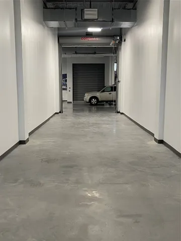 a view of a livingroom with a car parked in it