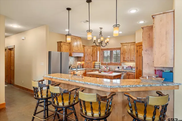 a view of a dining table and chairs