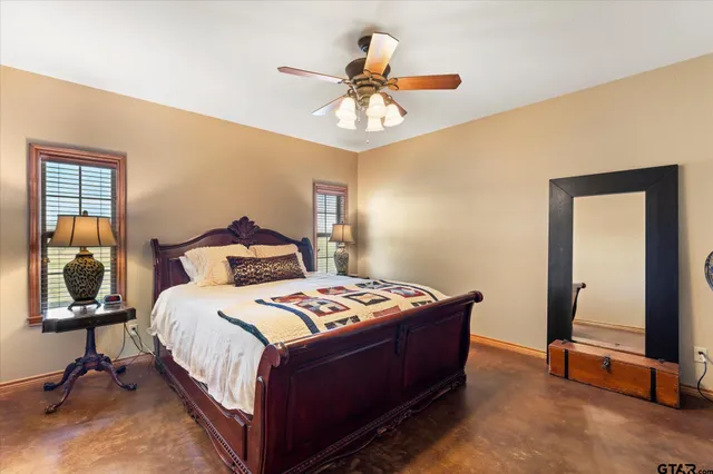 a bedroom with bed and a window