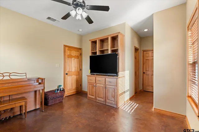 a room with furniture and a flat screen tv