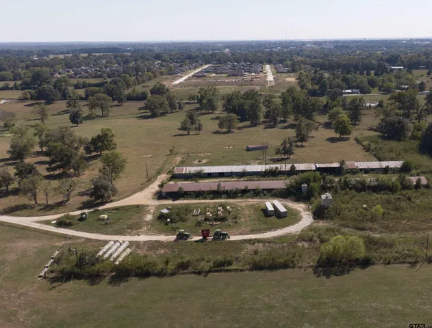 a view of a lake with houses in the back