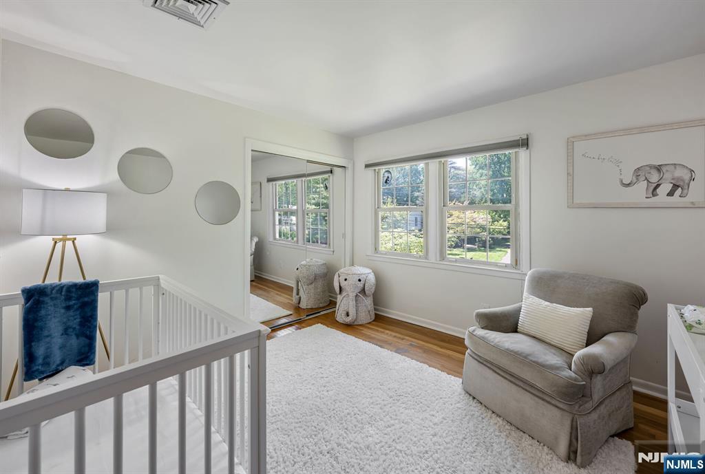 411 Snyder Road Wyckoff, NJ 07481 - Photo 22 of 36 a living room with furniture and a window