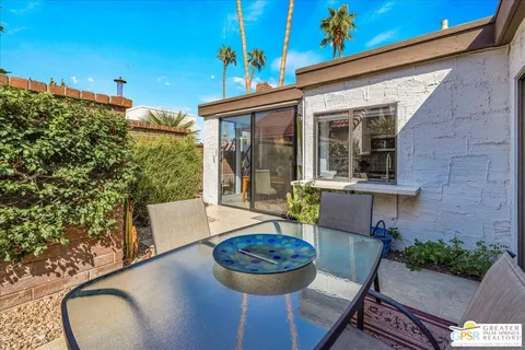 a view of a backyard with a patio
