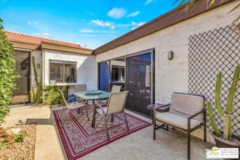 a bedroom with a large bed and a large window