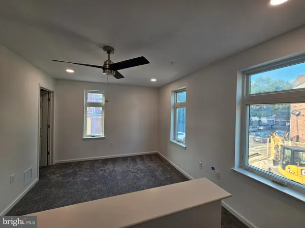 a room with window and ceiling fan