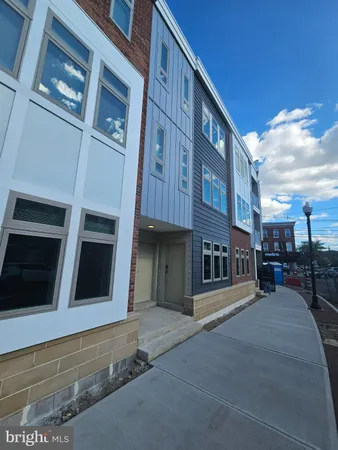 a view of a building with a street