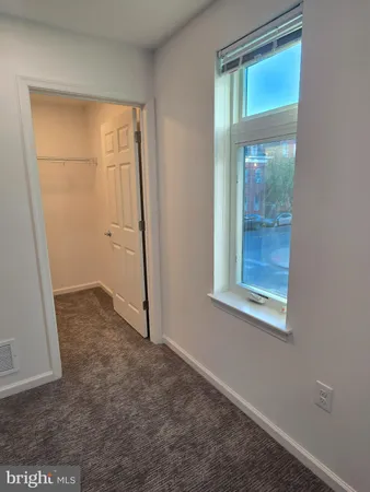 an empty room that has a window