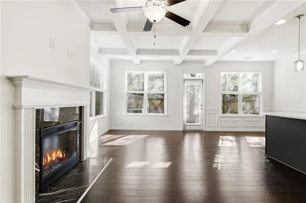 a living room with a fireplace and a fireplace