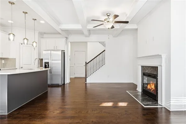 a kitchen with a sink and a stove top oven