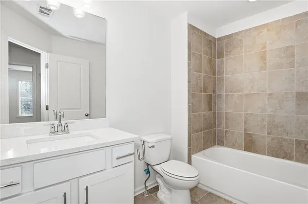 a bathroom with a shower and a toilet