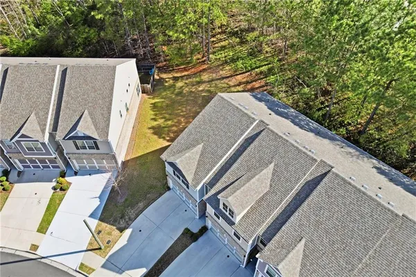 a view of a kitchen sink and dishwasher with wooden floor