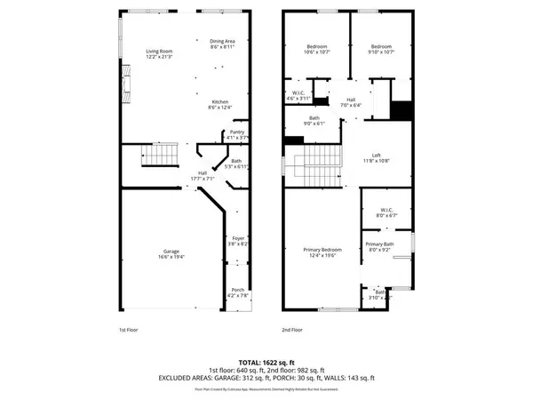 a view of a brick wall with a flower garden