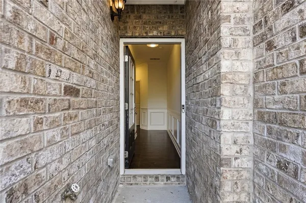 a view of entryway with wooden floor