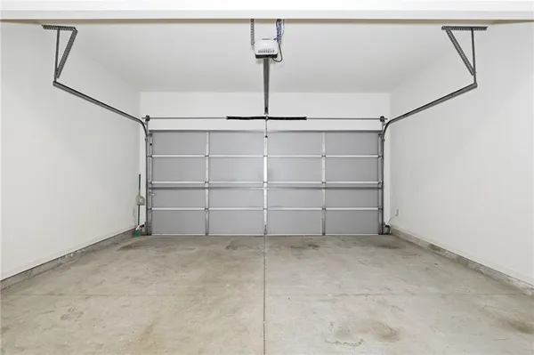 a view of an entryway with wooden floor and a ceiling fan