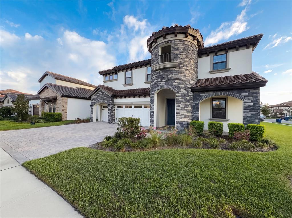 11277 Rustic Timber Loop San Antonio, FL 33576 - Photo 1 of 55 a front view of a house with a garden