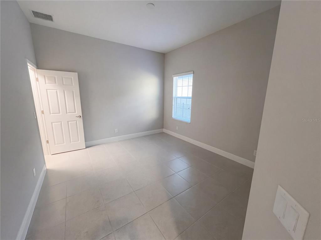 11277 Rustic Timber Loop San Antonio, FL 33576 - Photo 16 of 55 an empty room with windows