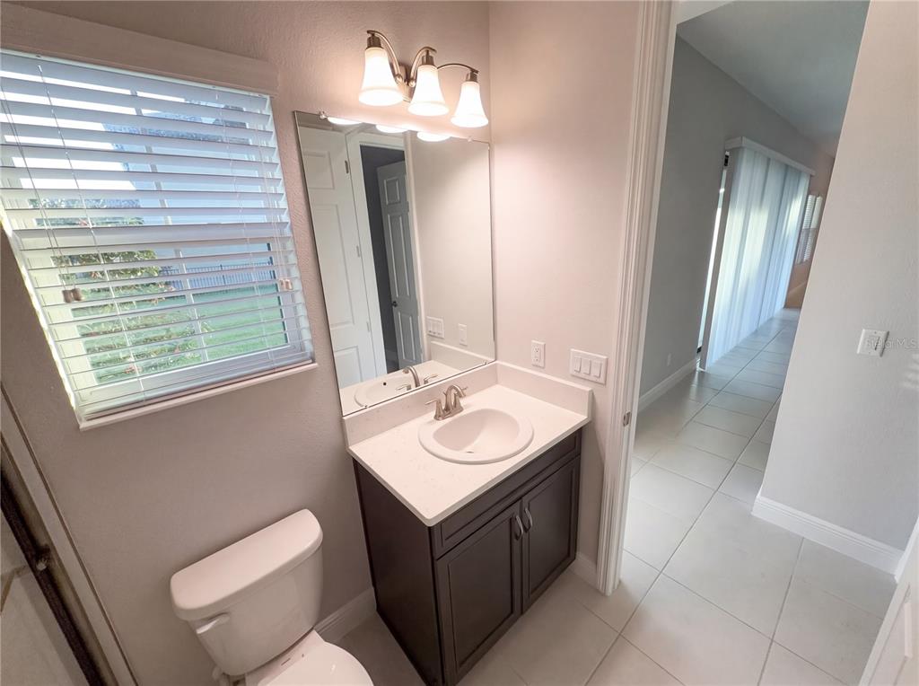 11277 Rustic Timber Loop San Antonio, FL 33576 - Photo 20 of 55 a bathroom with a sink and a mirror